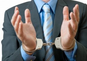 corrupt-executive-in-handcuffs1